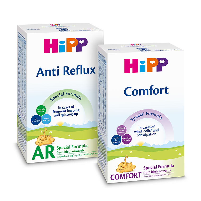Two boxes of baby formula, one labeled "Anti Reflux" and the other "Comfort," are displayed.