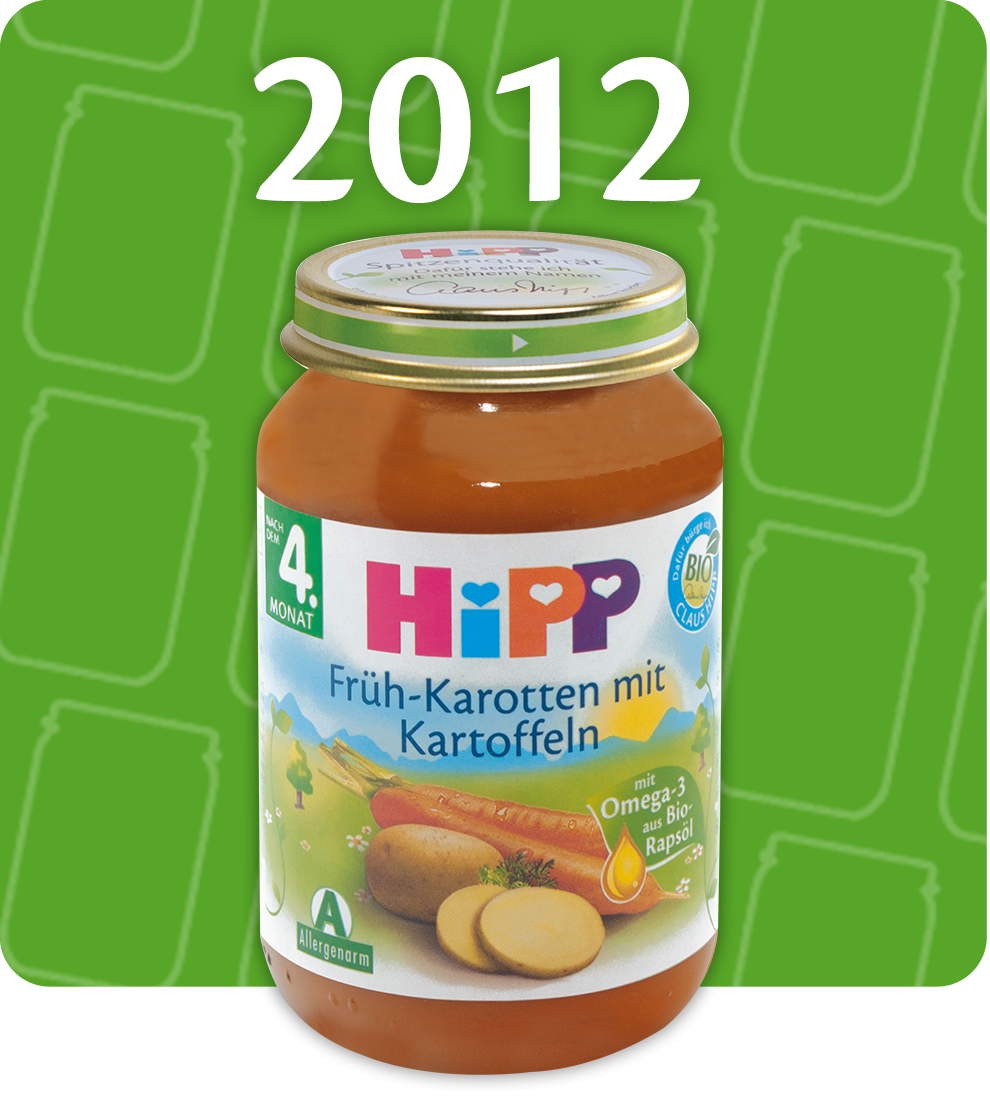 A 2012 Hipp baby food jar with a label in German, featuring carrots and potatoes, is displayed against a green background.