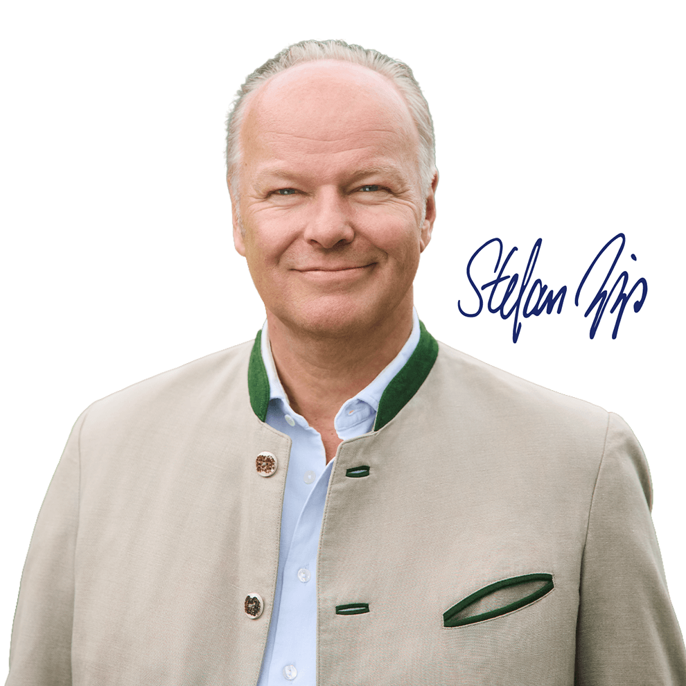 A man wearing a light-coloured jacket with decorative buttons and a green collar is depicted on a white background.